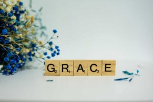 The letters for grace spelled out in Scrabble letters.
